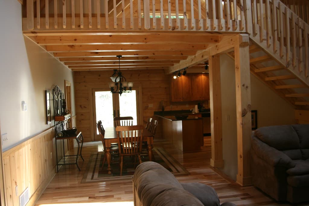 From the living room through to the dining table and kitchen, the loft rail running above on exposed beams