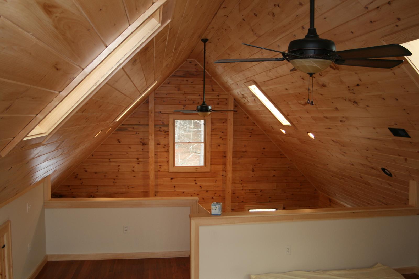 The same loft from the other side, skylight above and the bed under the eave