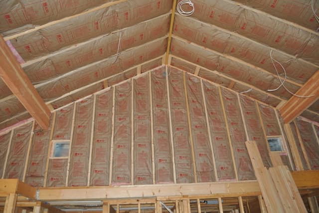 A cathedral ceiling insulated between its rafters, the ridge running the length of the roof