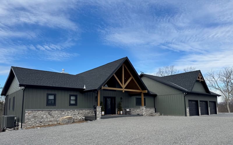 Hybrid — Board-and-batten, stone, and timber trusses
